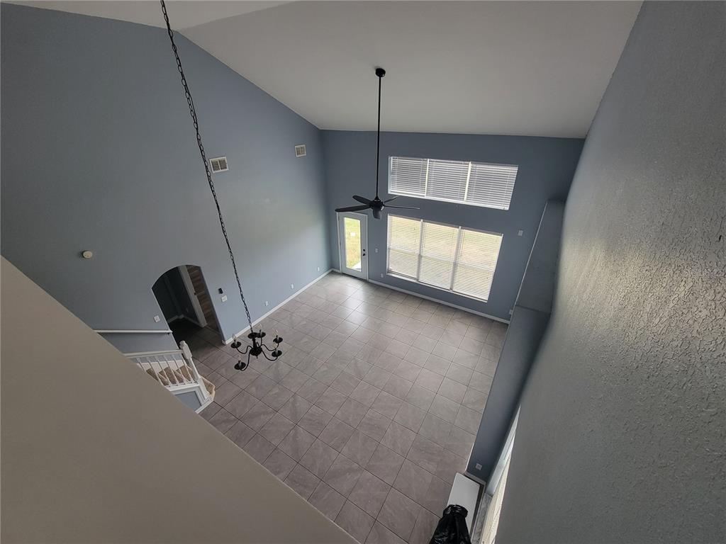2734 Rochelle Drive Winter Haven, FL 33881 - Photo 25 of 38 a view of a livingroom with a staircase
