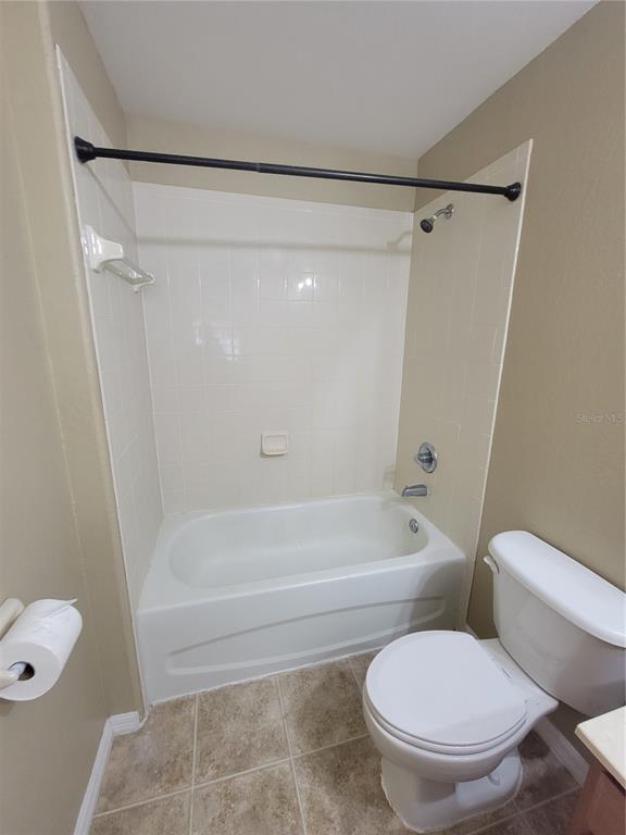 2734 Rochelle Drive Winter Haven, FL 33881 - Photo 27 of 38 a white toilet sitting next to a bath tub
