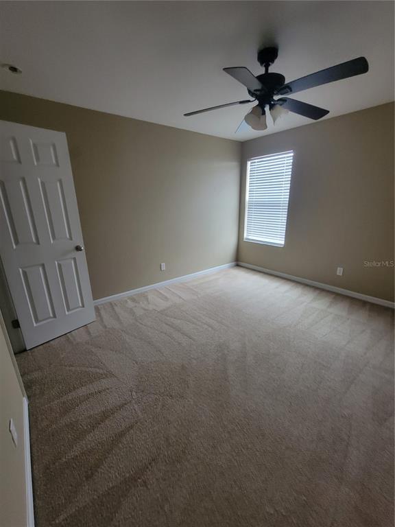 2734 Rochelle Drive Winter Haven, FL 33881 - Photo 28 of 38 a view of a livingroom with a ceiling fan and window
