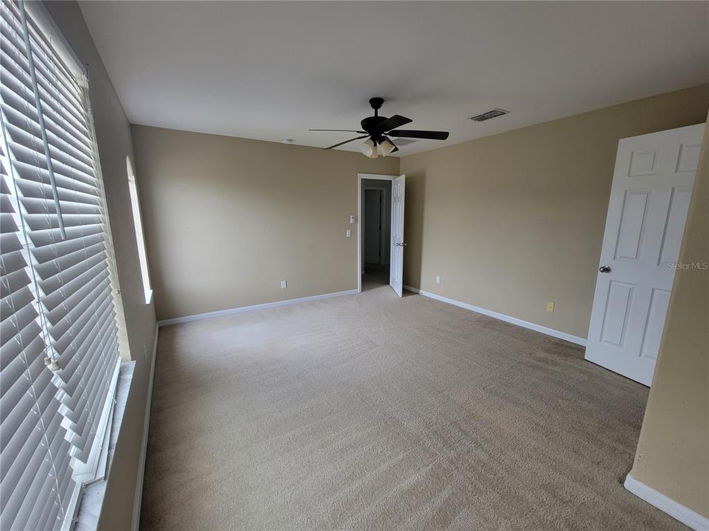2734 Rochelle Drive Winter Haven, FL 33881 - Photo 31 of 38 a view of a livingroom with a ceiling fan and window