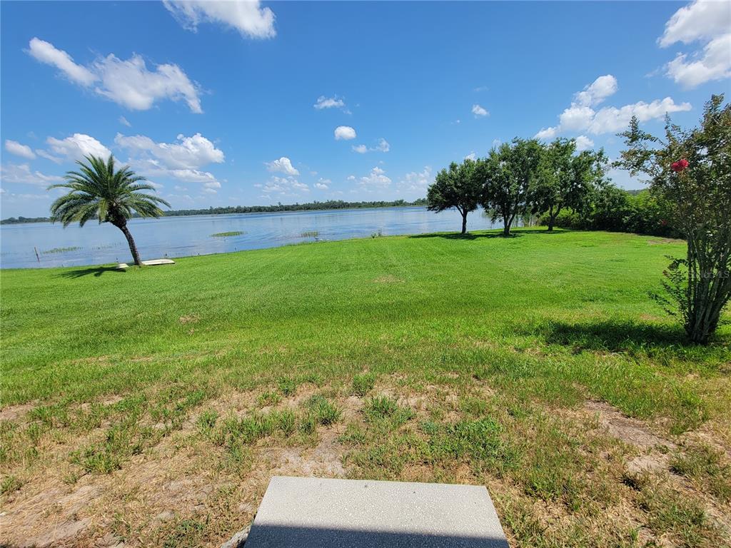 2734 Rochelle Drive Winter Haven, FL 33881 - Photo 37 of 38 a view of yard with swimming pool and green space