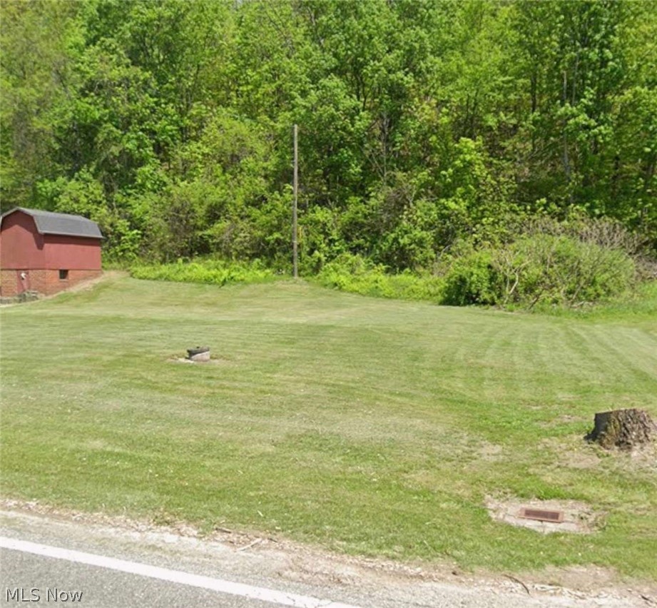 Marietta Road Cumberland, OH 43732 - Photo 1 of 9 View of grassy yard with an outdoor structure