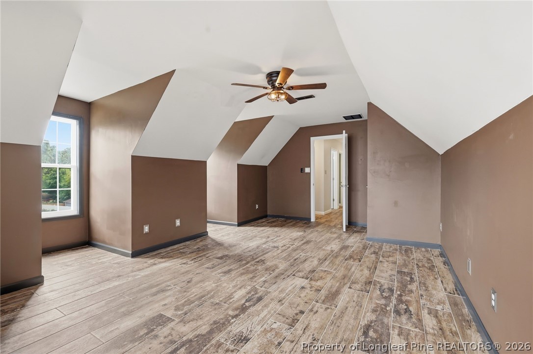 5113 Archer Road Hope Mills, NC 28348 - Photo 21 of 41 a view of an empty room with window and wooden floor
