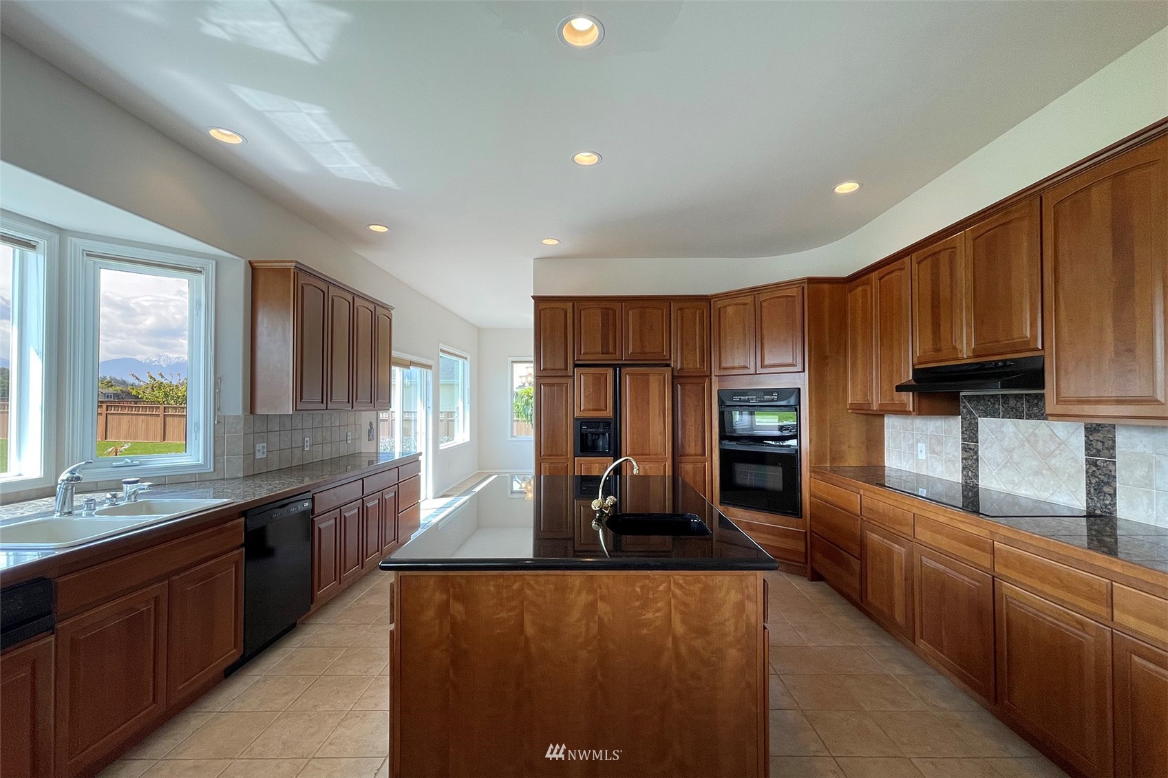 402 Marine Drive Sequim, WA 98382 - Photo 11 of 40 a large kitchen with stainless steel appliances lots of counter top space