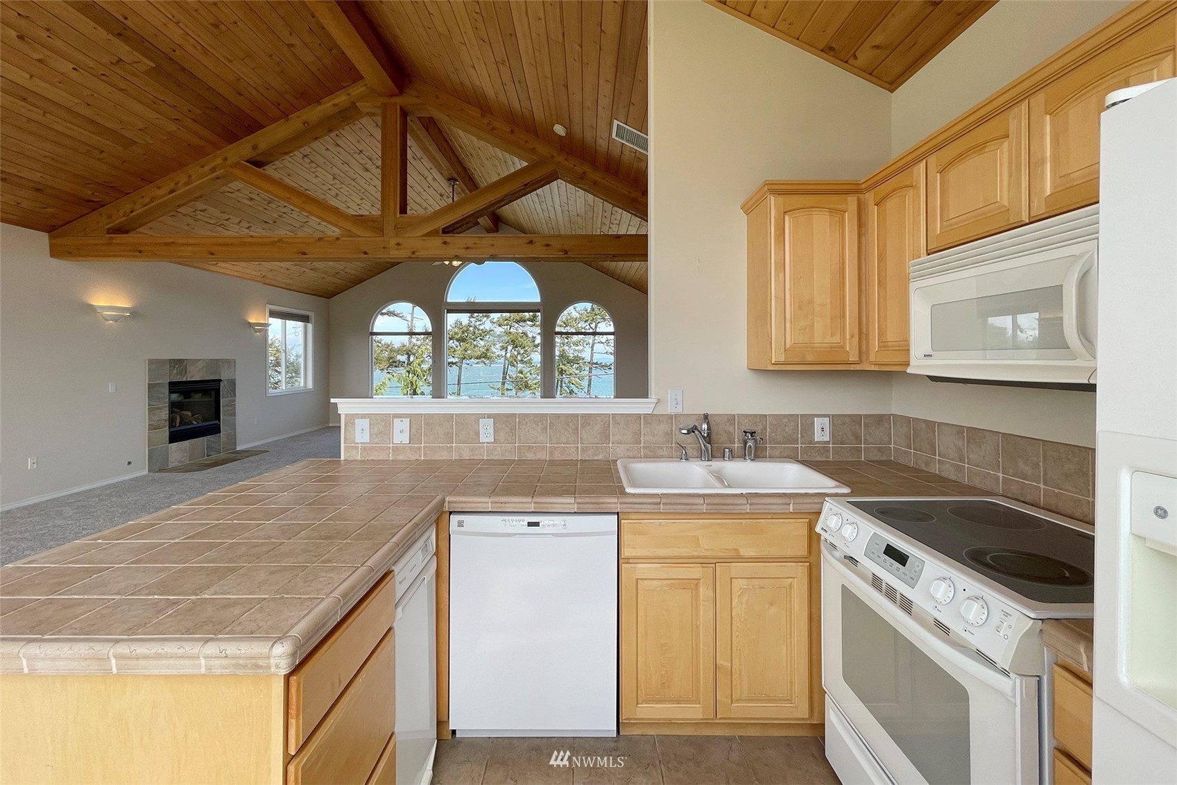 402 Marine Drive Sequim, WA 98382 - Photo 16 of 40 a kitchen with a stove a sink and a microwave