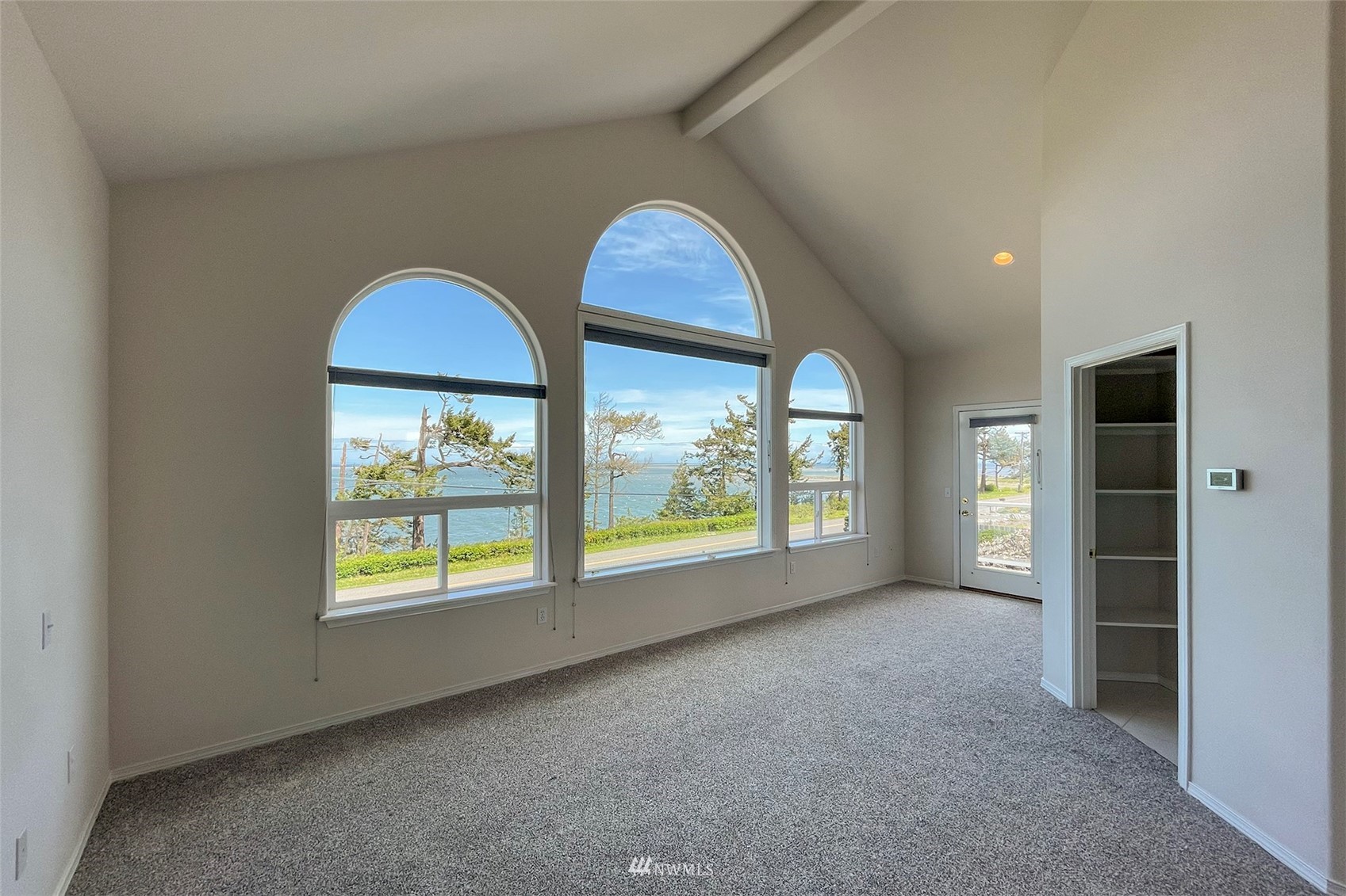402 Marine Drive Sequim, WA 98382 - Photo 18 of 40 an empty room with windows and closet