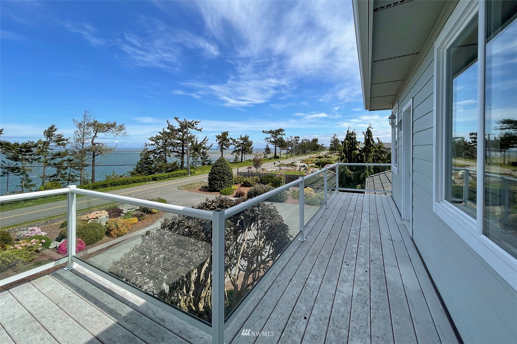 402 Marine Drive Sequim, WA 98382 - Photo 20 of 40 a view of a balcony with wooden floor and fence