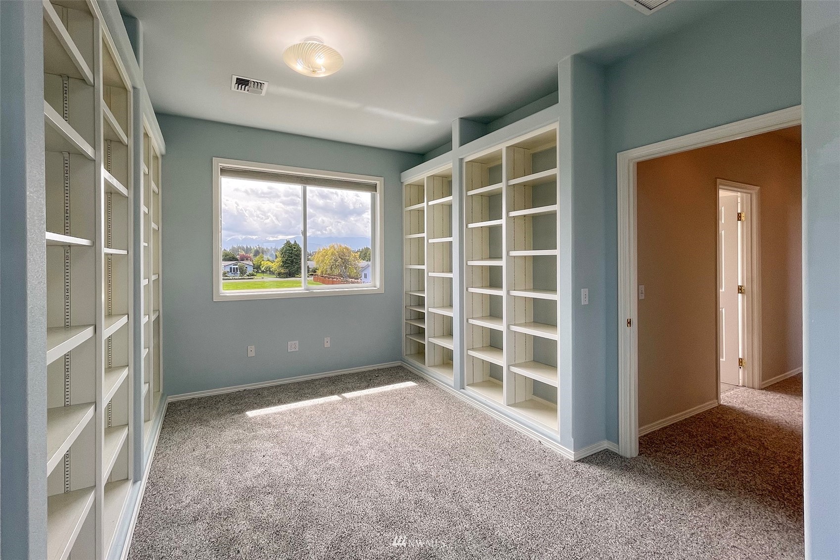 402 Marine Drive Sequim, WA 98382 - Photo 27 of 40 an empty room with windows and closet