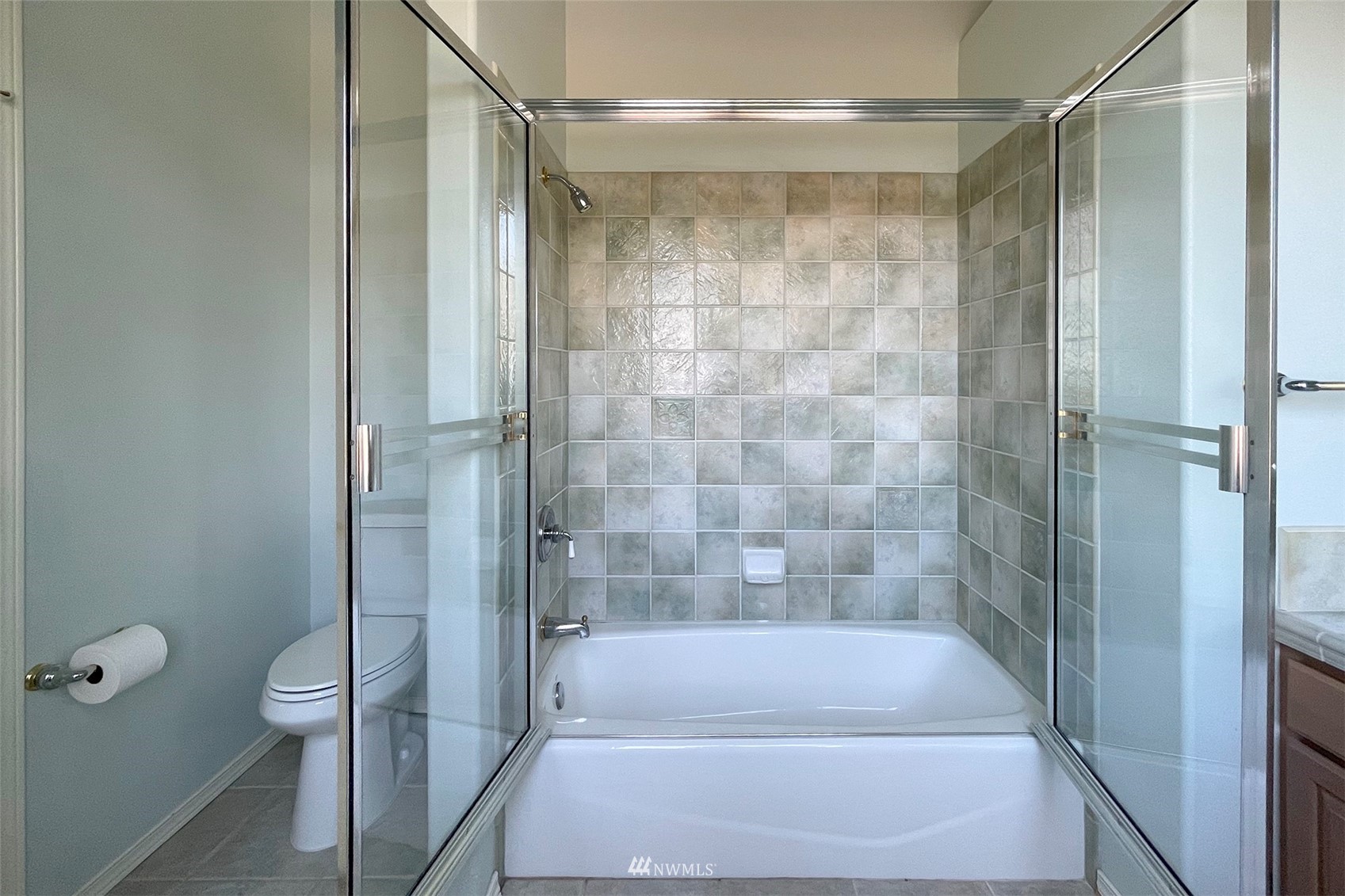 402 Marine Drive Sequim, WA 98382 - Photo 35 of 40 a bathroom with a glass shower door