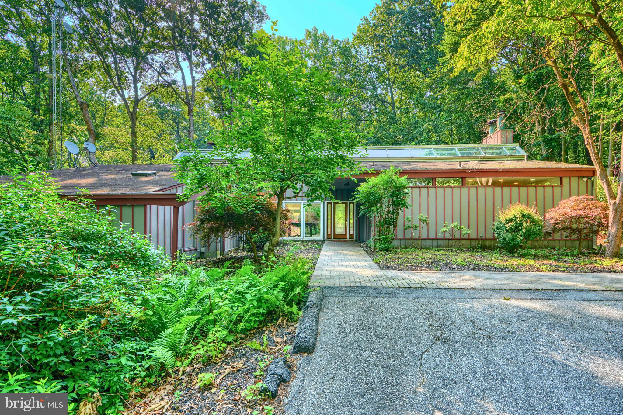 2101 Tufton Avenue Reisterstown, MD 21136 - Photo 2 of 125 a front view of a house with a yard and potted plants