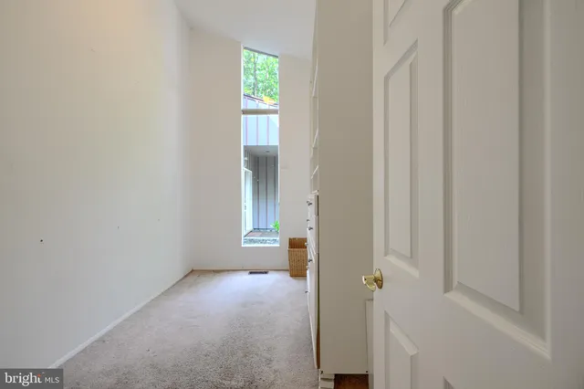 a bathroom with a sink a toilet a mirror and shower