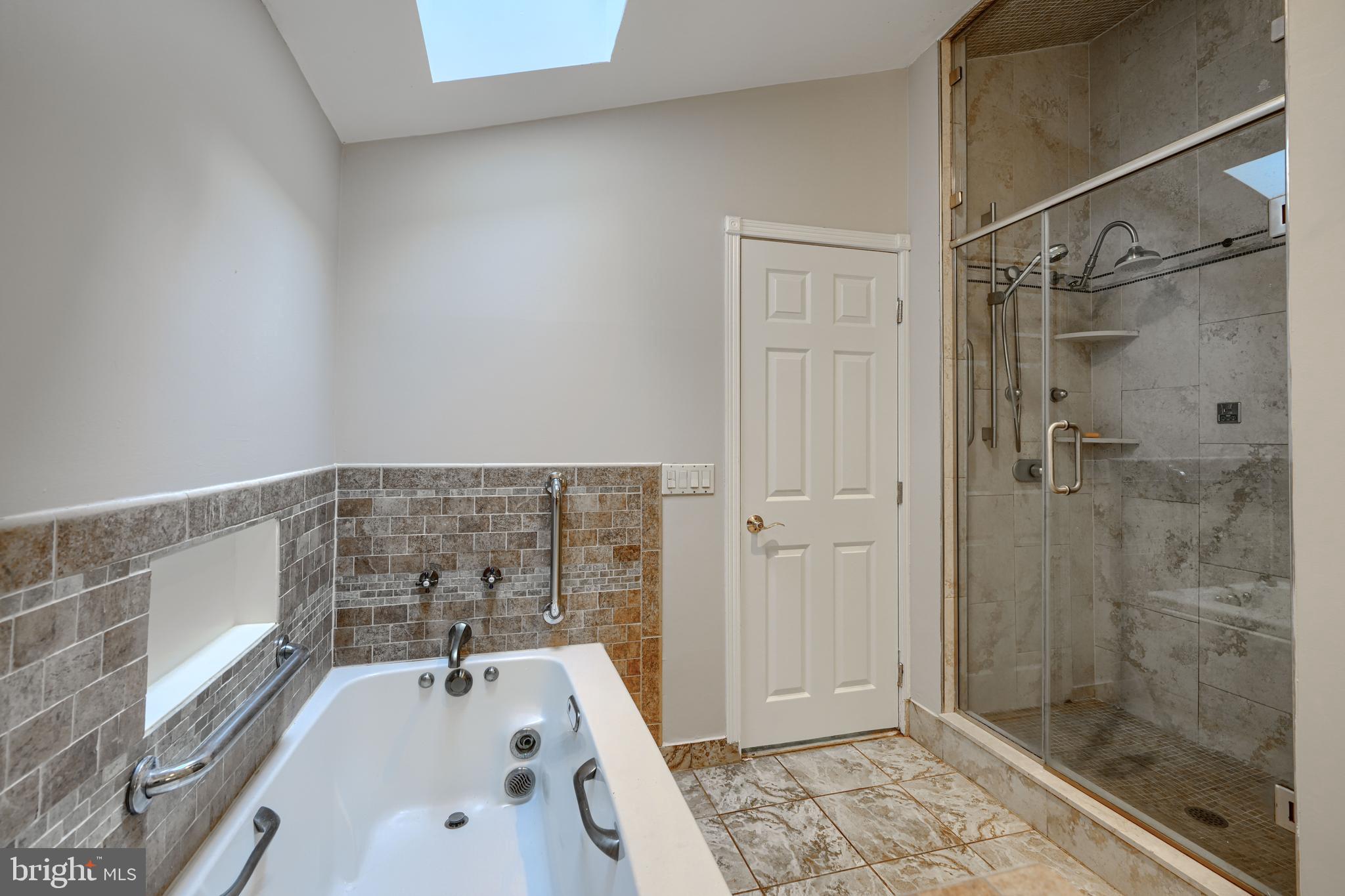 2101 Tufton Avenue Reisterstown, MD 21136 - Photo 40 of 125 a bathroom with a tub and a shower