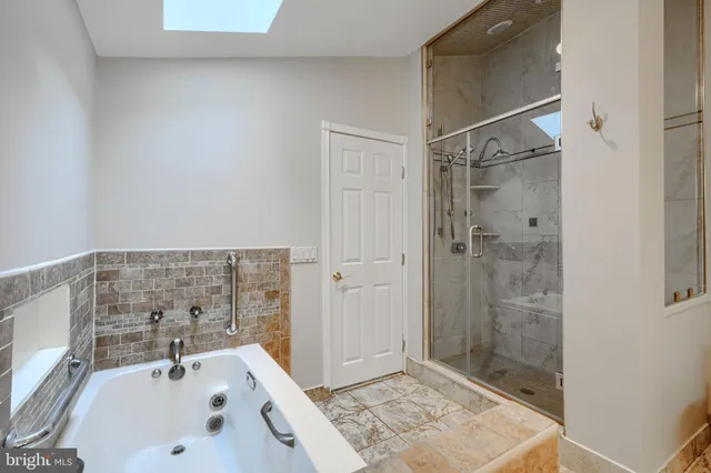 a view of a roof deck with wooden fence