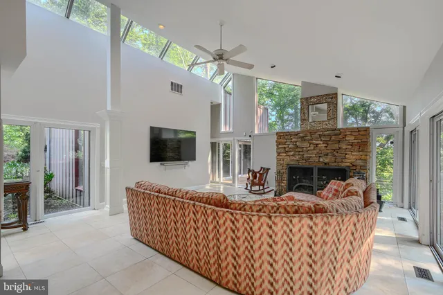 a living room with couch and a large window