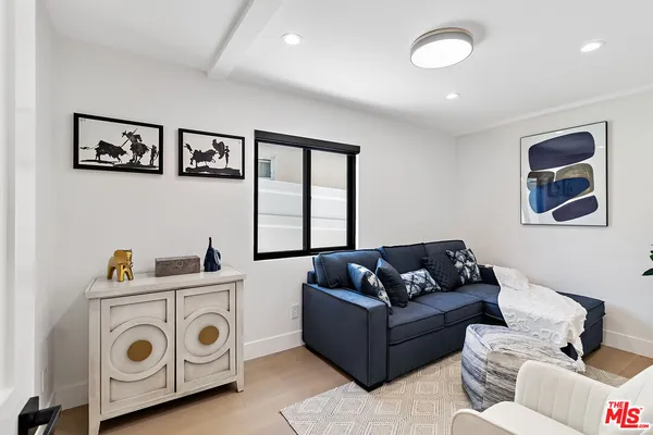 a living room with furniture and window