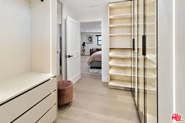 a room with a furniture and a walk in closet