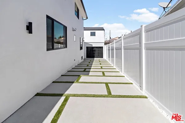 a view of a backyard with a patio