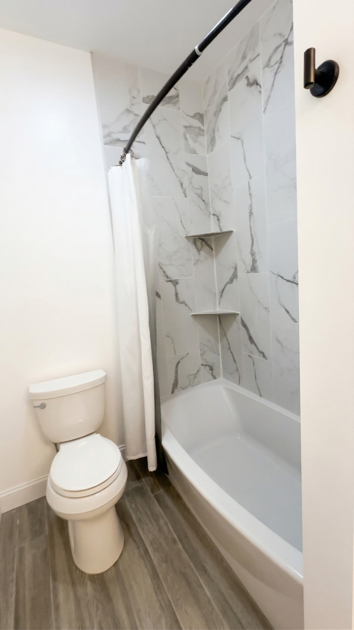 28 Henderson Road Lynchburg, TN 37352 - Photo 60 of 87 a white toilet sitting next to a bath tub and a shower