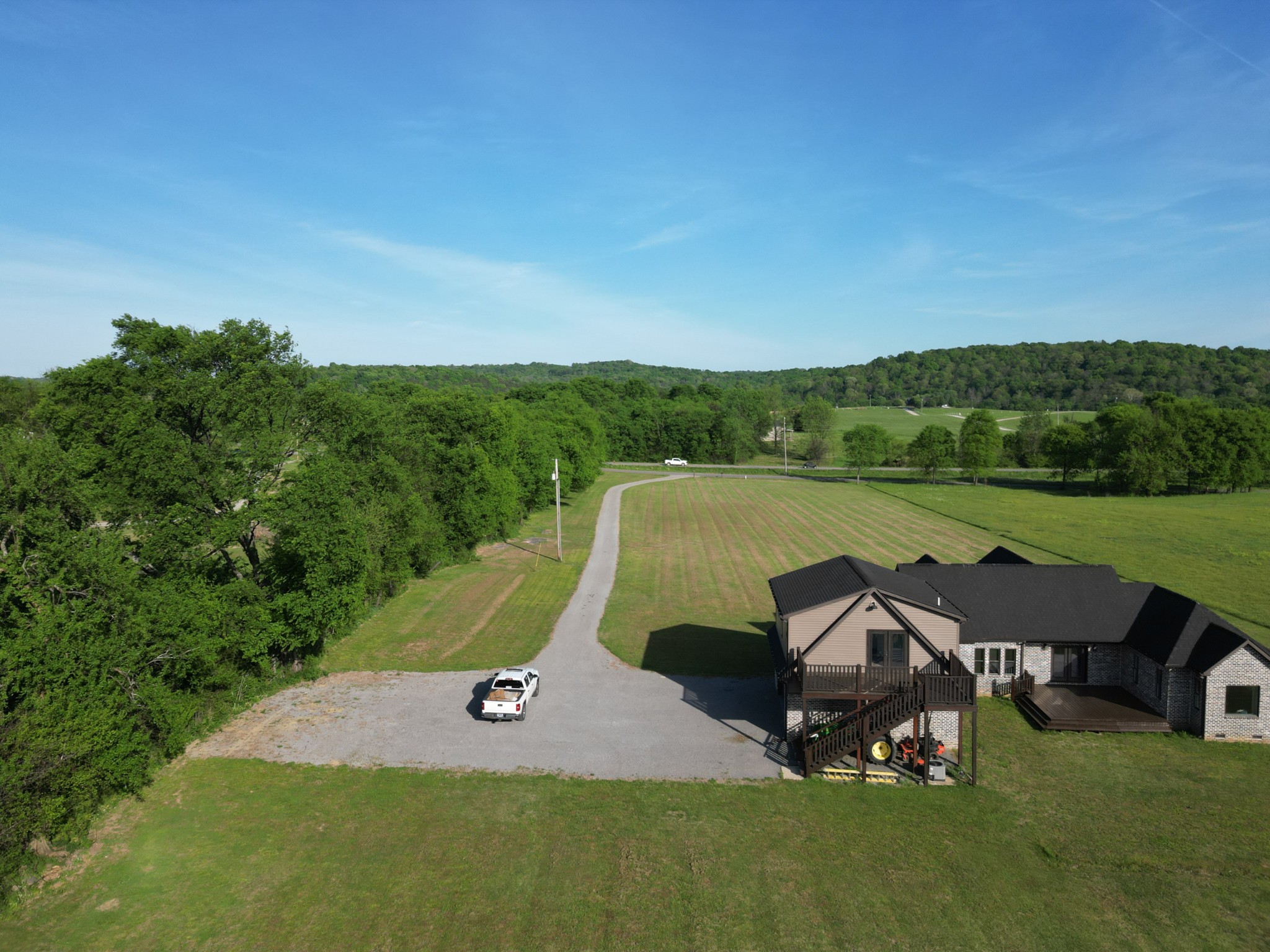 28 Henderson Road Lynchburg, TN 37352 - Photo 75 of 87 a view of a lake with a yard and a wooden fence