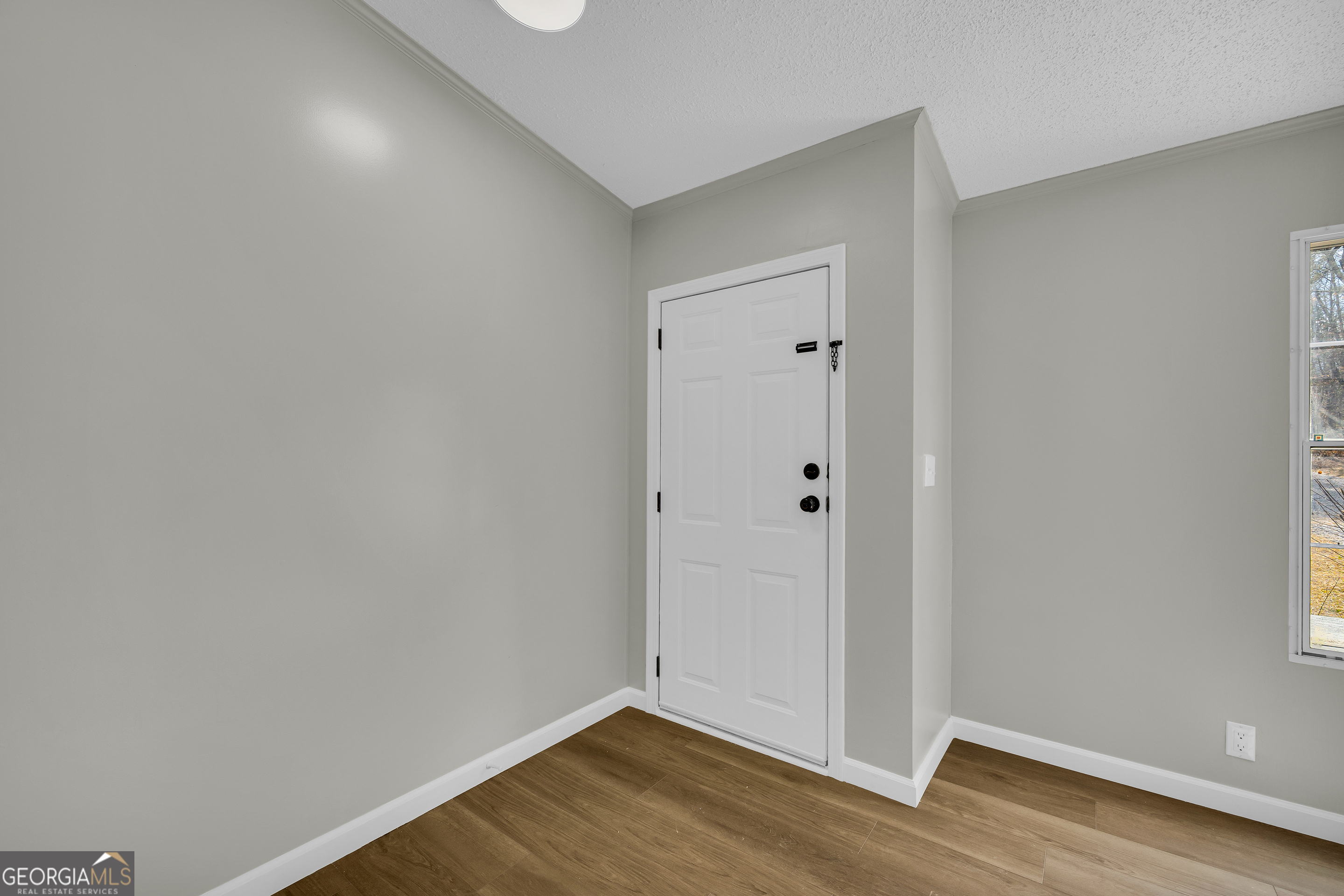 60 Tribble Bottoms Road Arnoldsville, GA 30619 - Photo 11 of 66 a view of an empty room with wooden floor