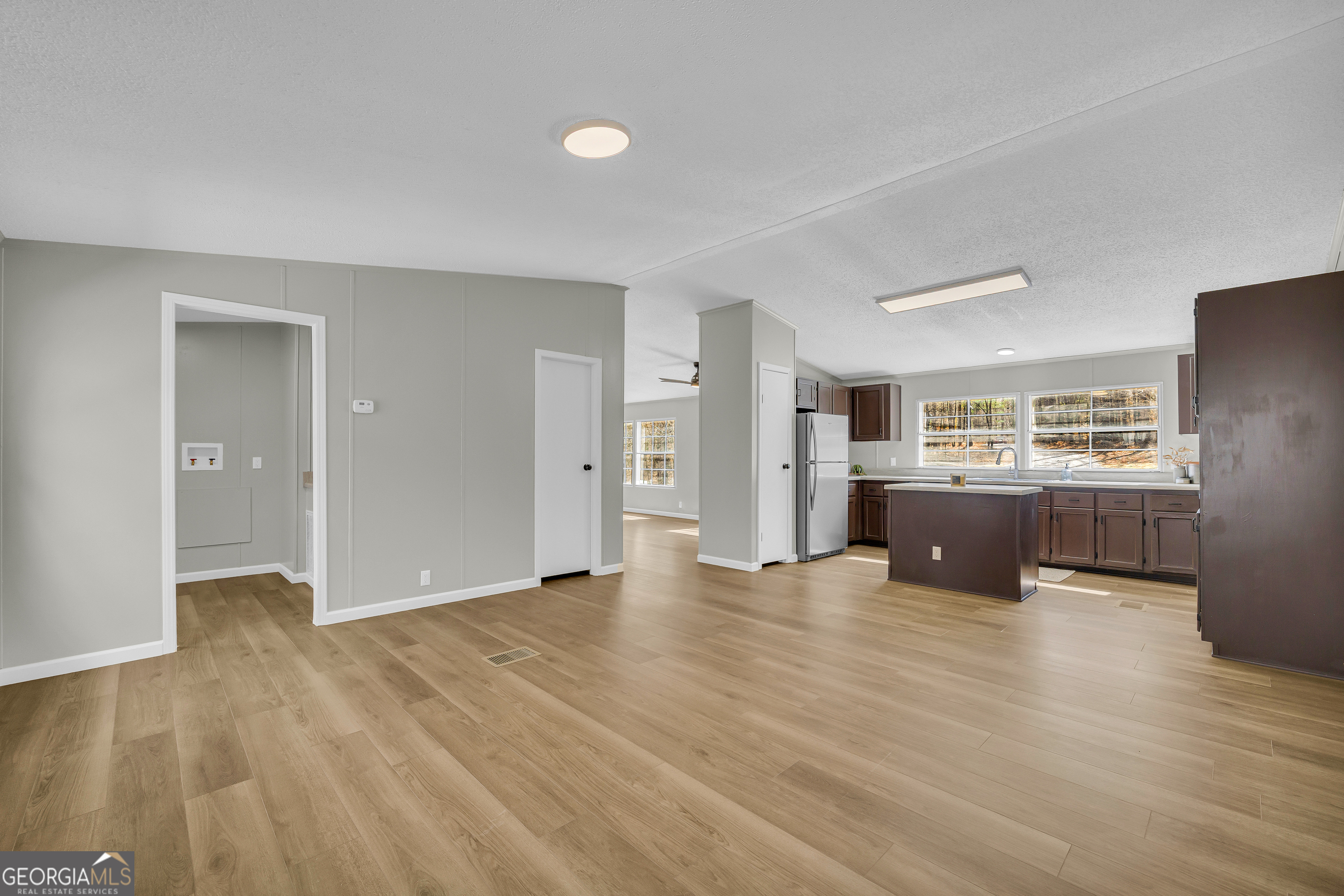 60 Tribble Bottoms Road Arnoldsville, GA 30619 - Photo 16 of 66 a view of a kitchen with a refrigerator and a sink