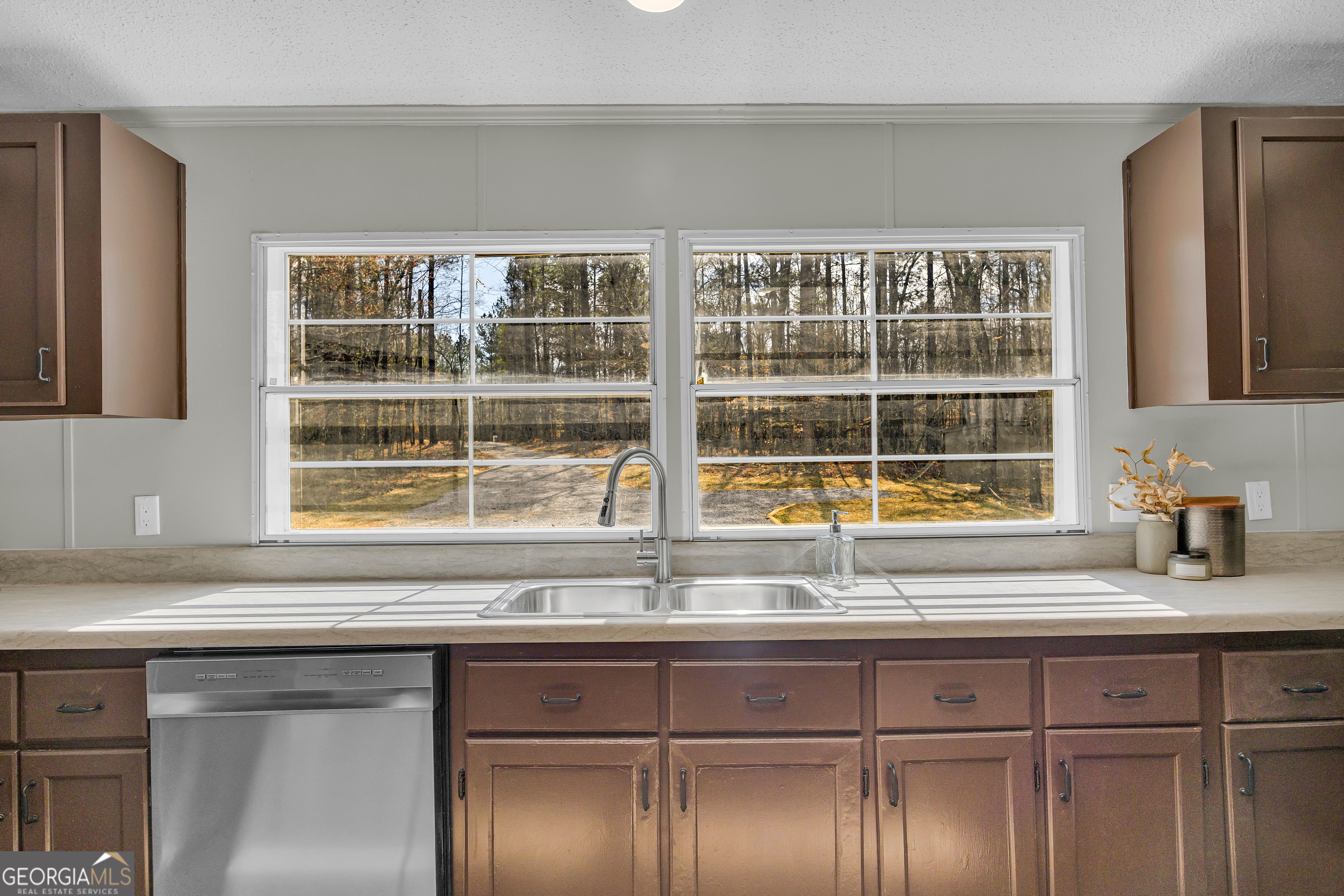 60 Tribble Bottoms Road Arnoldsville, GA 30619 - Photo 19 of 66 a kitchen with a sink and a window