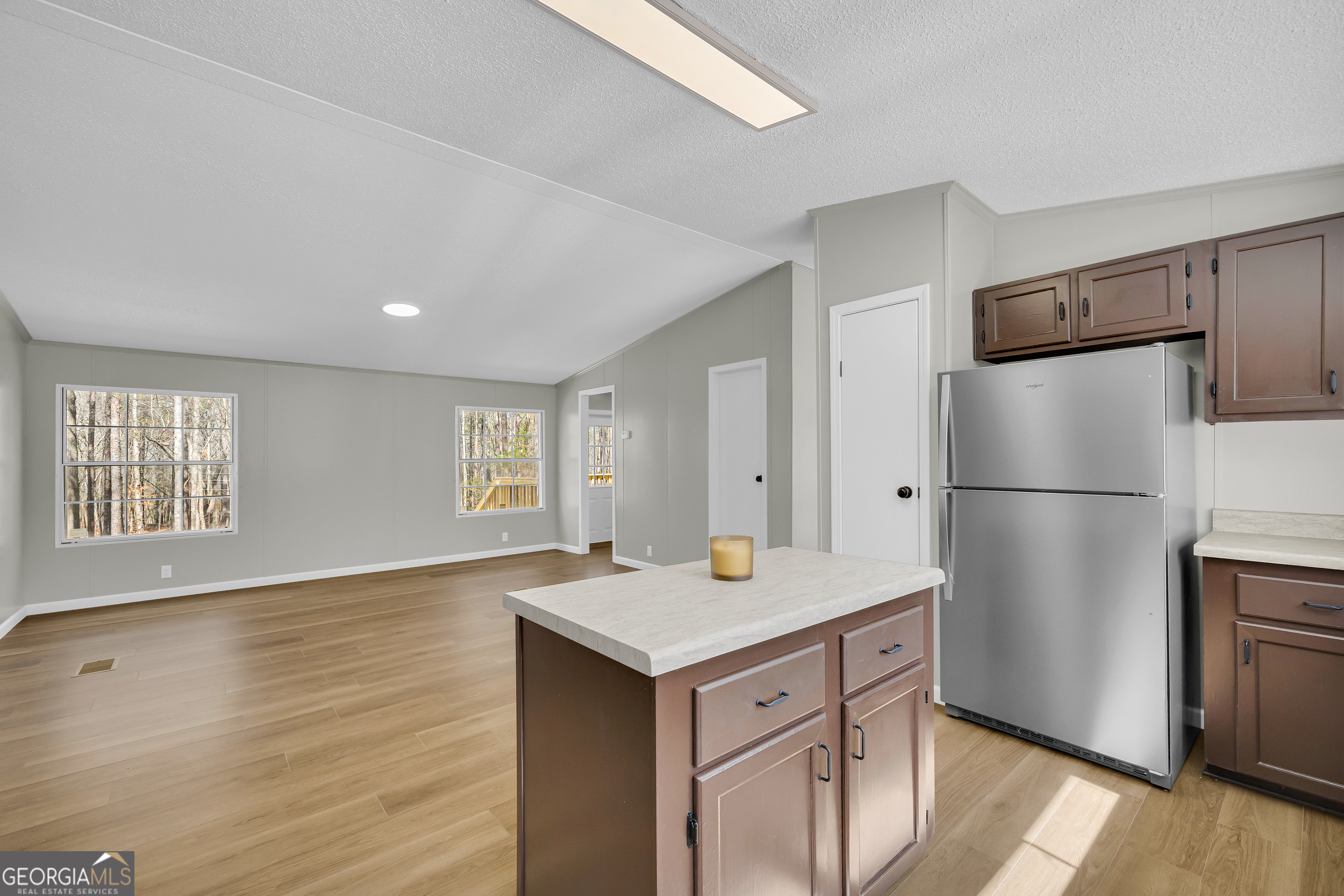 60 Tribble Bottoms Road Arnoldsville, GA 30619 - Photo 21 of 66 a kitchen with a refrigerator and a stove top oven