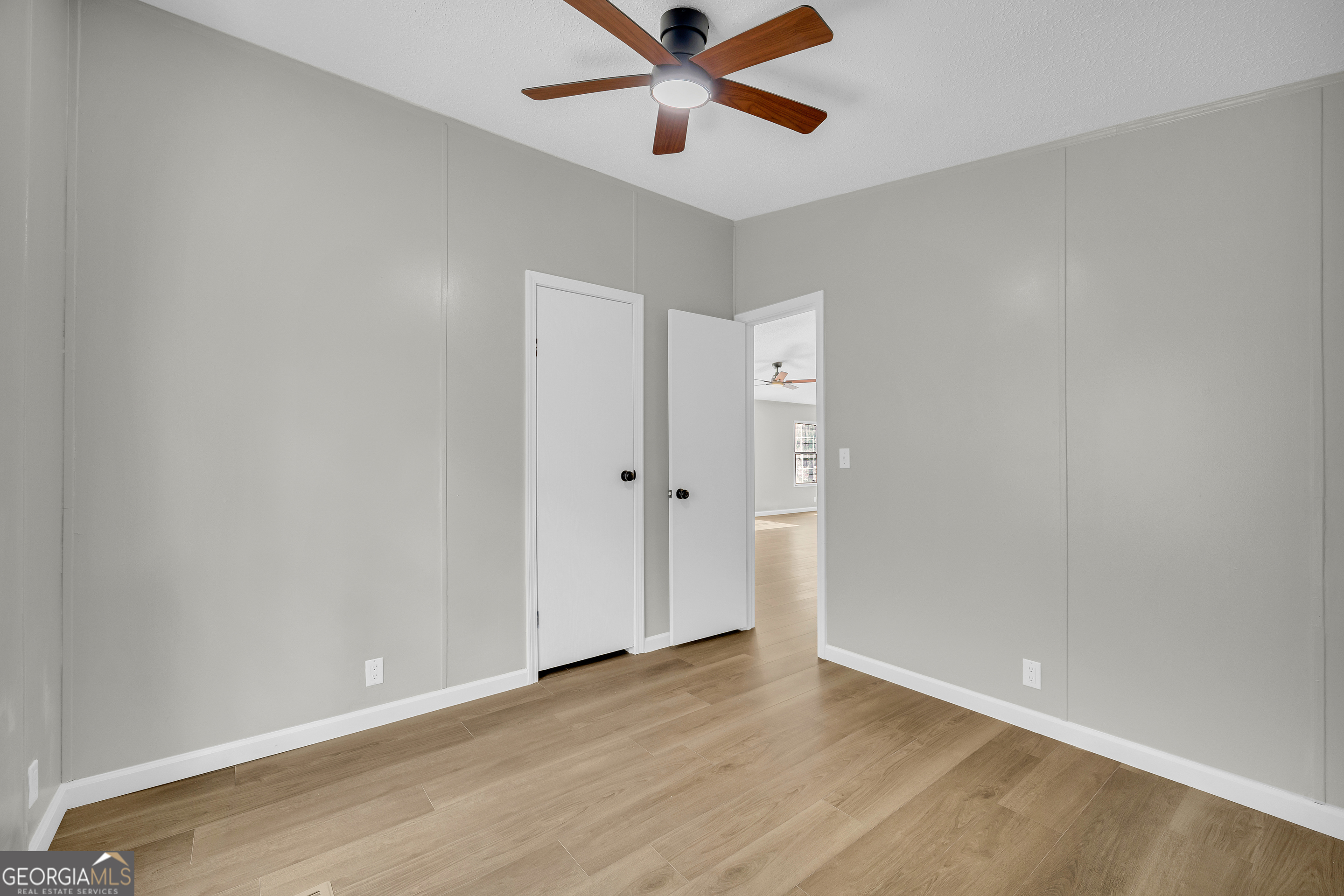 60 Tribble Bottoms Road Arnoldsville, GA 30619 - Photo 25 of 66 a view of an empty room with wooden floor