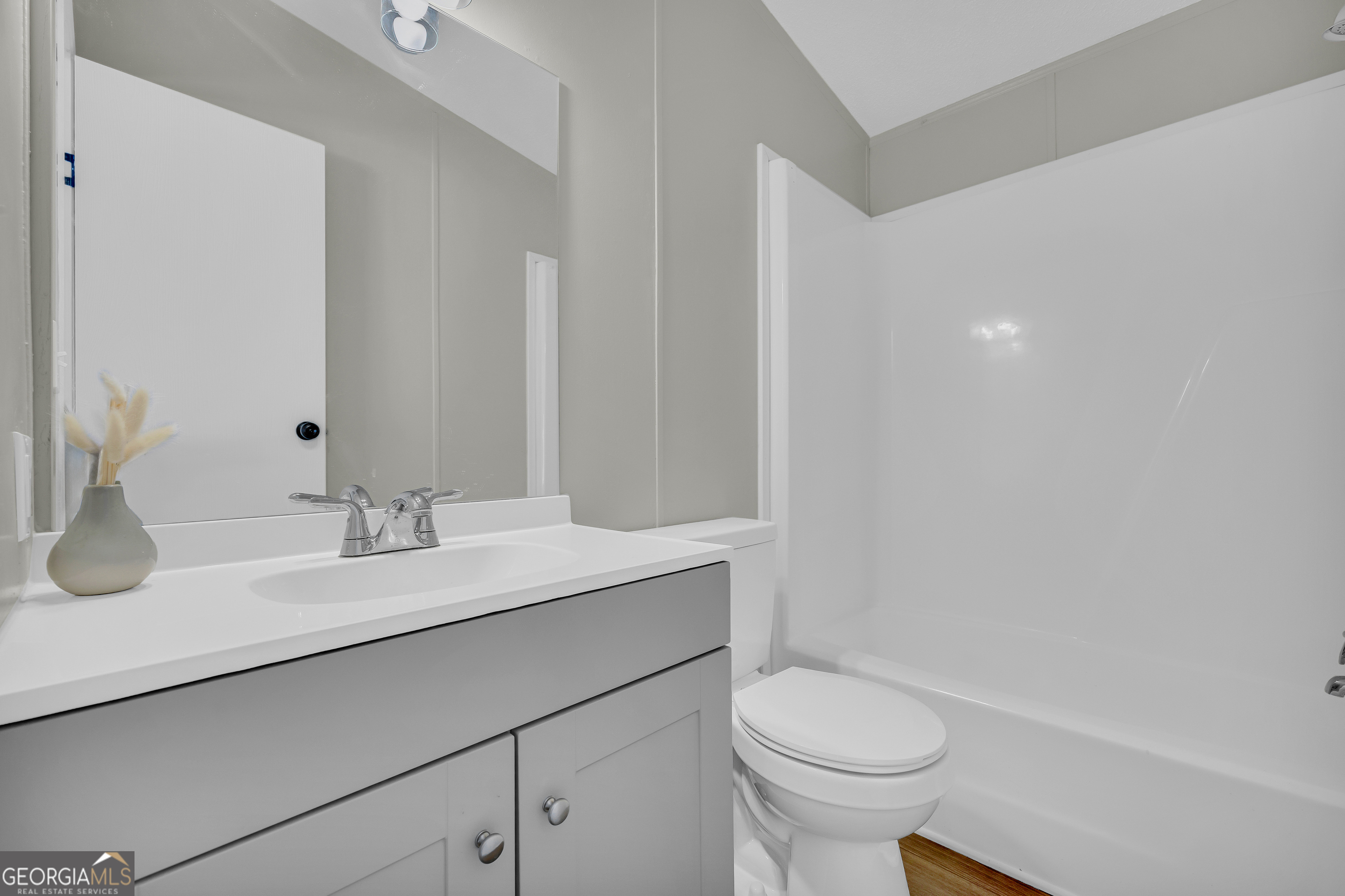 60 Tribble Bottoms Road Arnoldsville, GA 30619 - Photo 28 of 66 a bathroom with a sink a toilet and a mirror