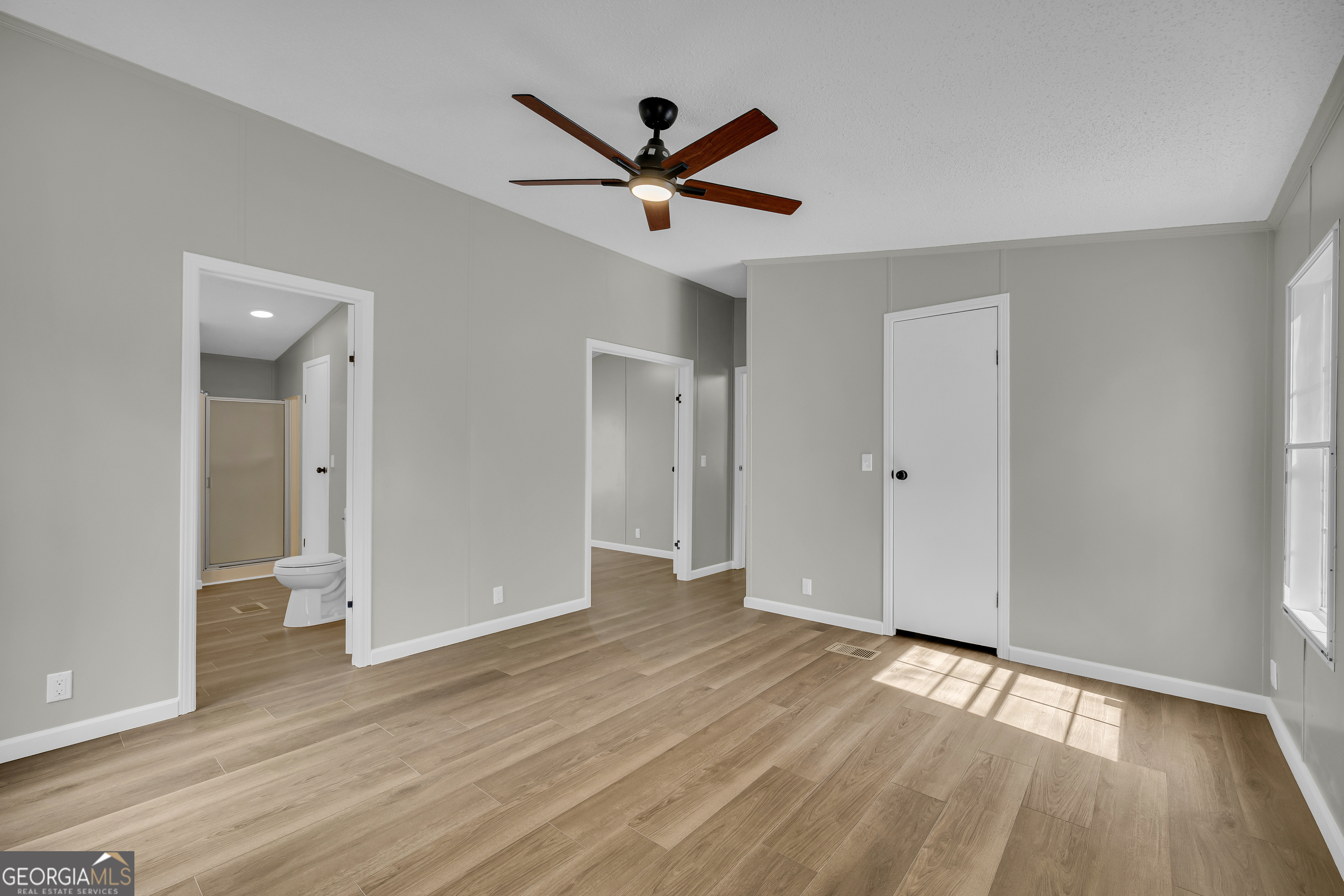 60 Tribble Bottoms Road Arnoldsville, GA 30619 - Photo 32 of 66 wooden floor in an empty room with a window