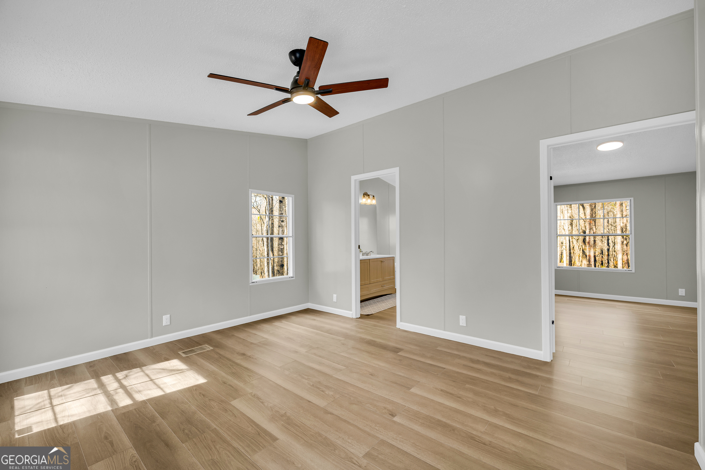 60 Tribble Bottoms Road Arnoldsville, GA 30619 - Photo 33 of 66 a view of an empty room with window and wooden floor