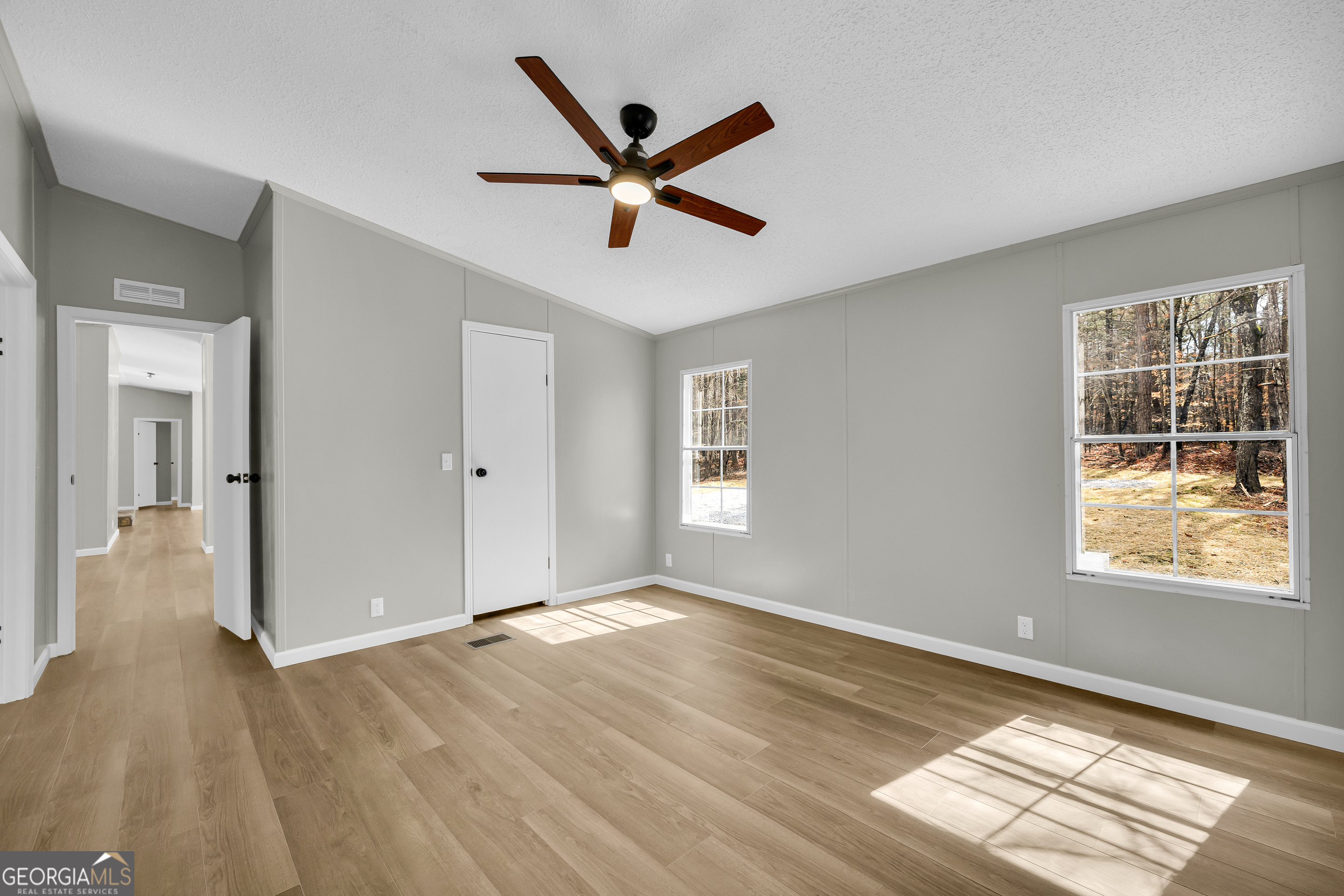 60 Tribble Bottoms Road Arnoldsville, GA 30619 - Photo 34 of 66 a view of a big room with wooden floor and windows
