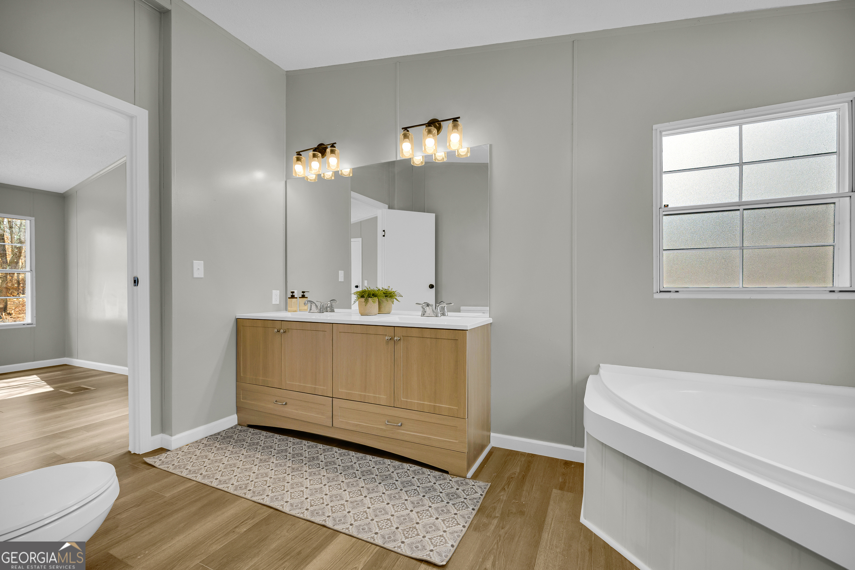 60 Tribble Bottoms Road Arnoldsville, GA 30619 - Photo 37 of 66 a bathroom with a sink and a mirror