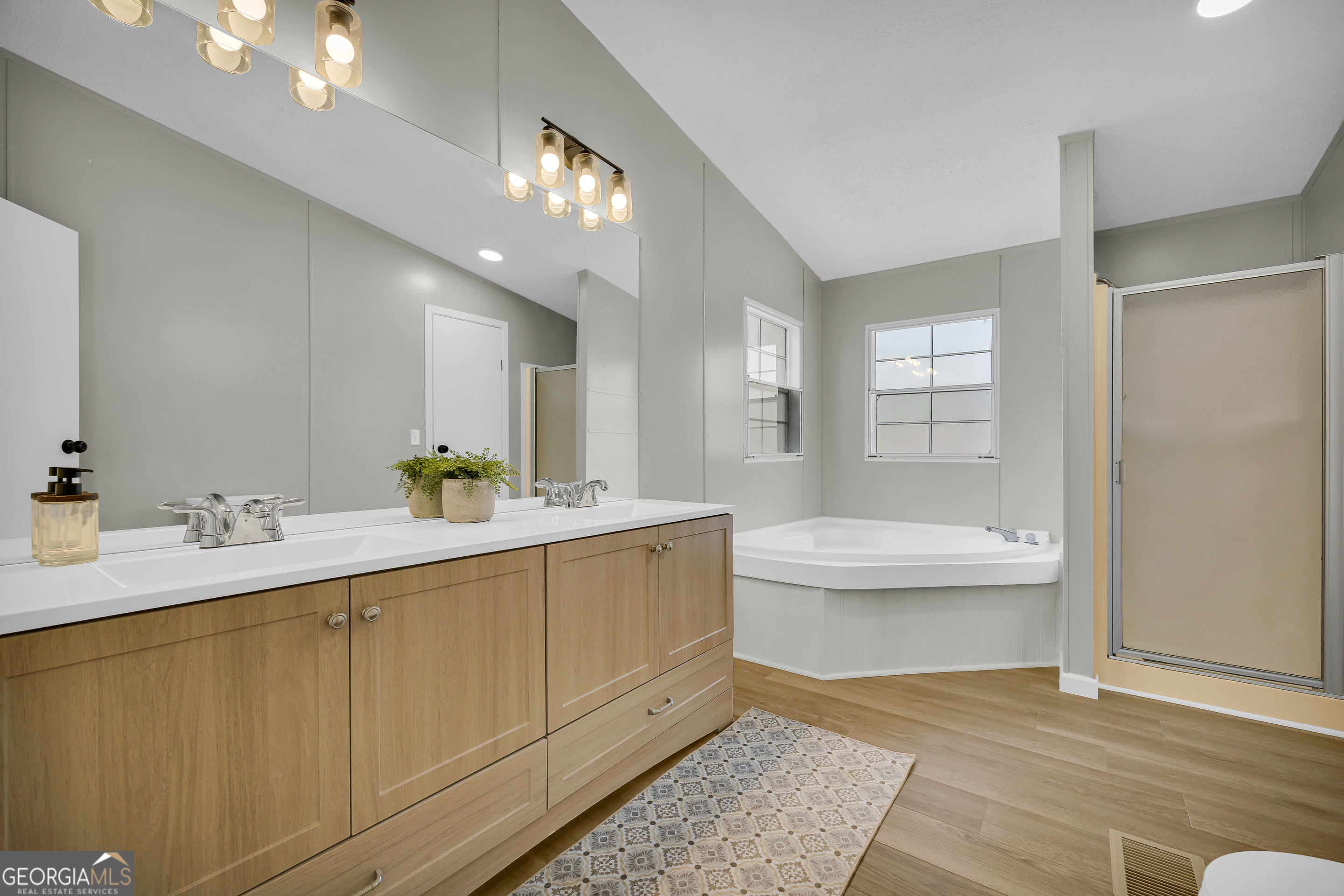 60 Tribble Bottoms Road Arnoldsville, GA 30619 - Photo 39 of 66 a bathroom with a sink a toilet and shower