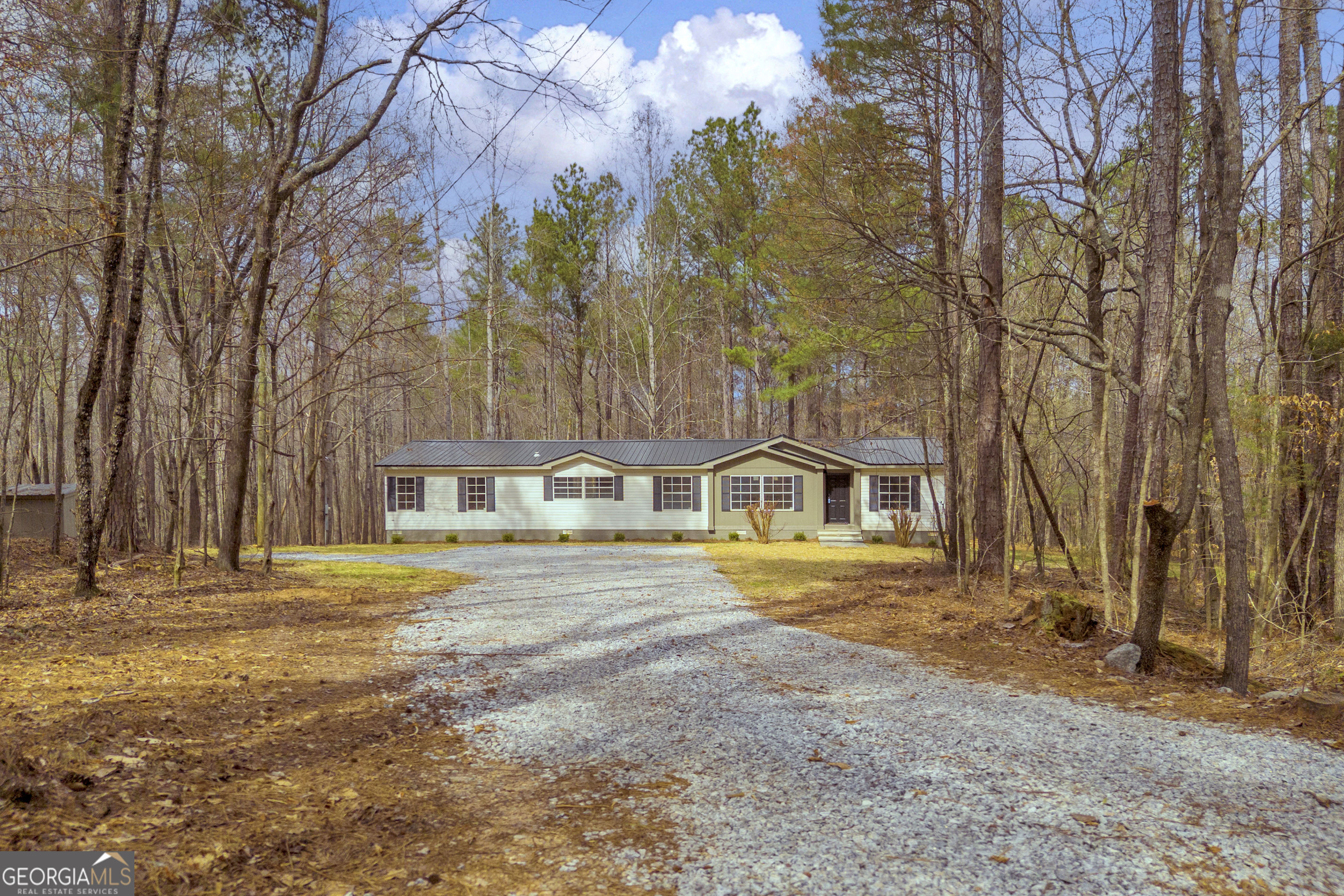 60 Tribble Bottoms Road Arnoldsville, GA 30619 - Photo 7 of 66 a front view of a house with a yard