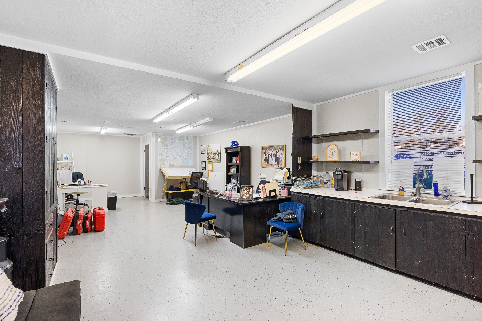 217 West W Hill Navasota, TX 77868 - Photo 3 of 21 a living room with furniture and a kitchen