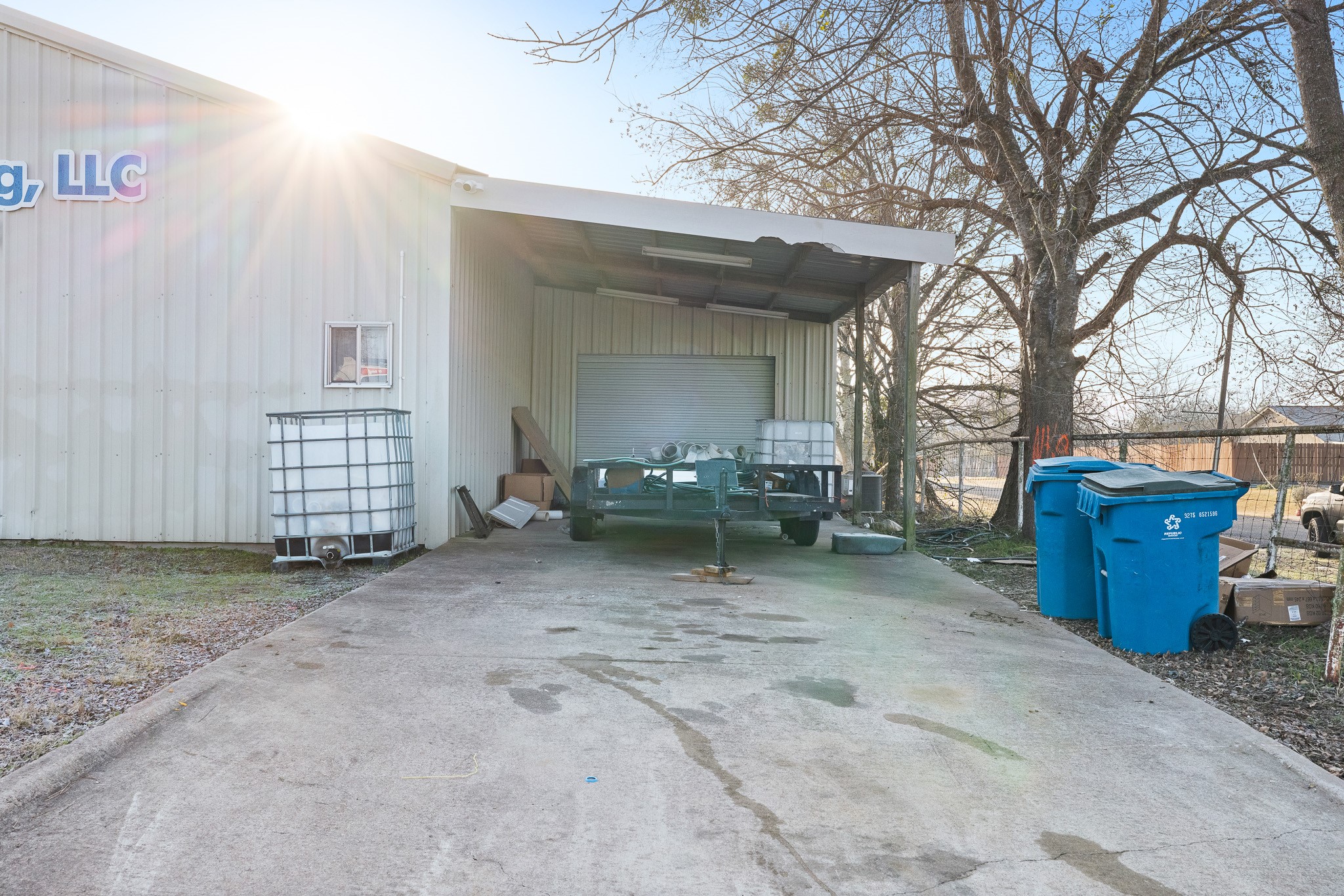 217 West W Hill Navasota, TX 77868 - Photo 10 of 21 a view of a house with a space and trees