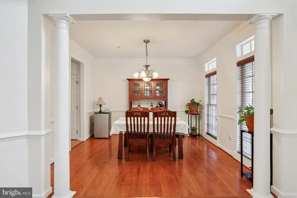 a bedroom with furniture and wooden floor