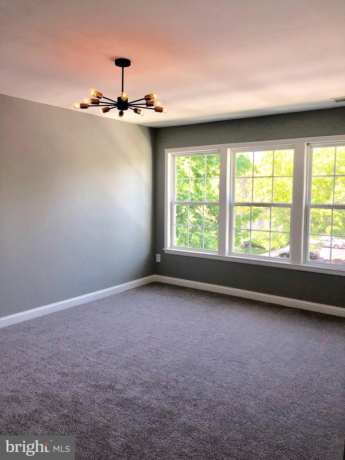 301 Trinity Court, Unit 10 Princeton, NJ 08540 - Photo 11 of 19 an empty room with a window