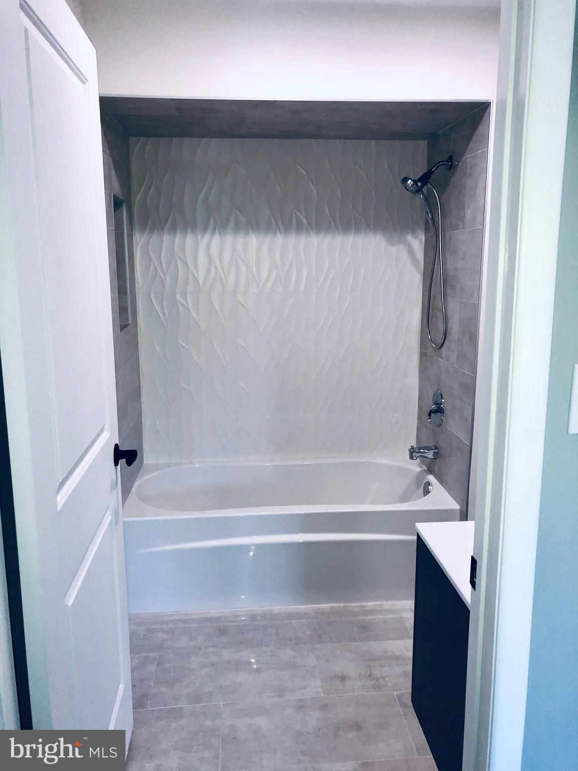 301 Trinity Court, Unit 10 Princeton, NJ 08540 - Photo 13 of 19 a bathroom with a bathtub and a shower