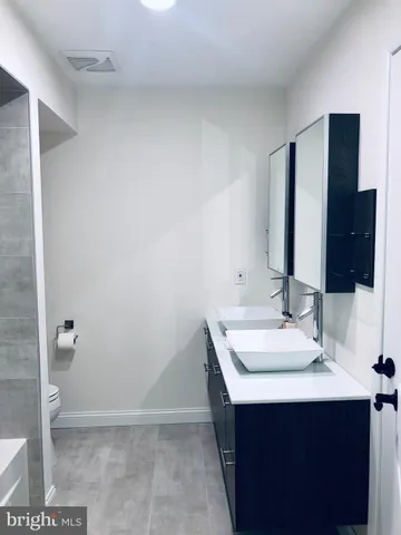 a front view of house with a garden