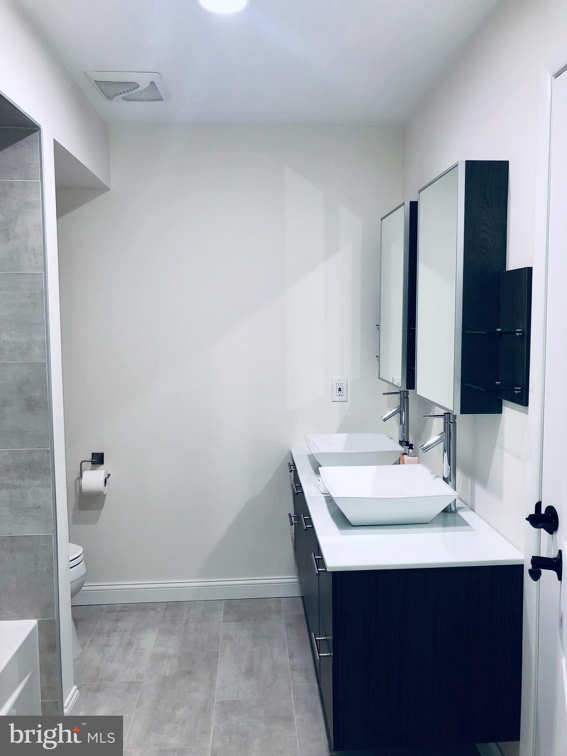 301 Trinity Court, Unit 10 Princeton, NJ 08540 - Photo 16 of 19 a bathroom with a sink and a mirror