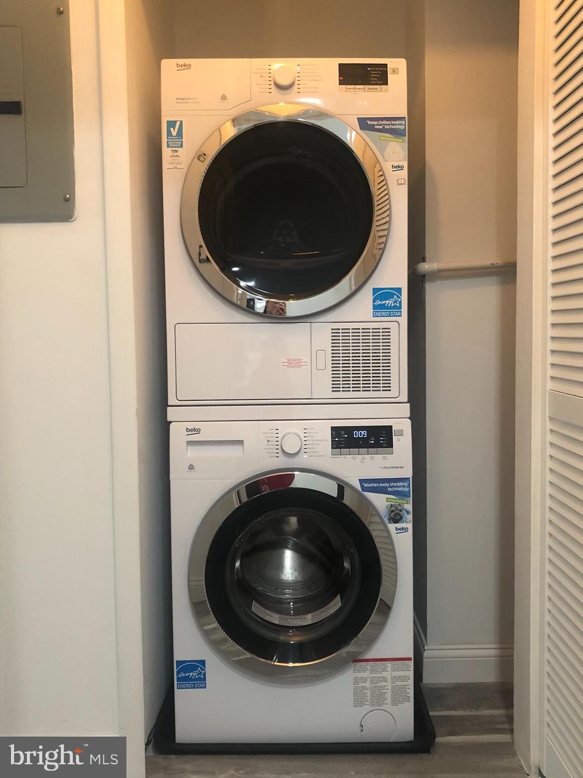 301 Trinity Court, Unit 10 Princeton, NJ 08540 - Photo 19 of 19 a utility room with dryer and washer
