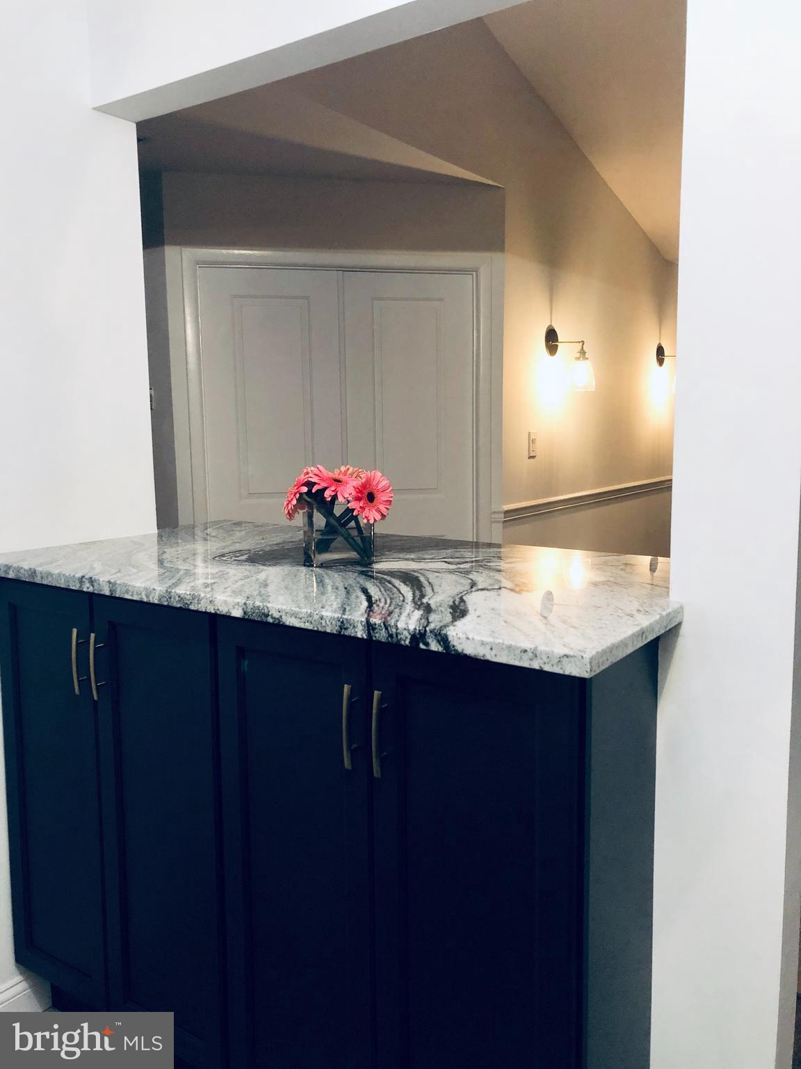 301 Trinity Court, Unit 10 Princeton, NJ 08540 - Photo 4 of 19 a bathroom with a sink and a mirror