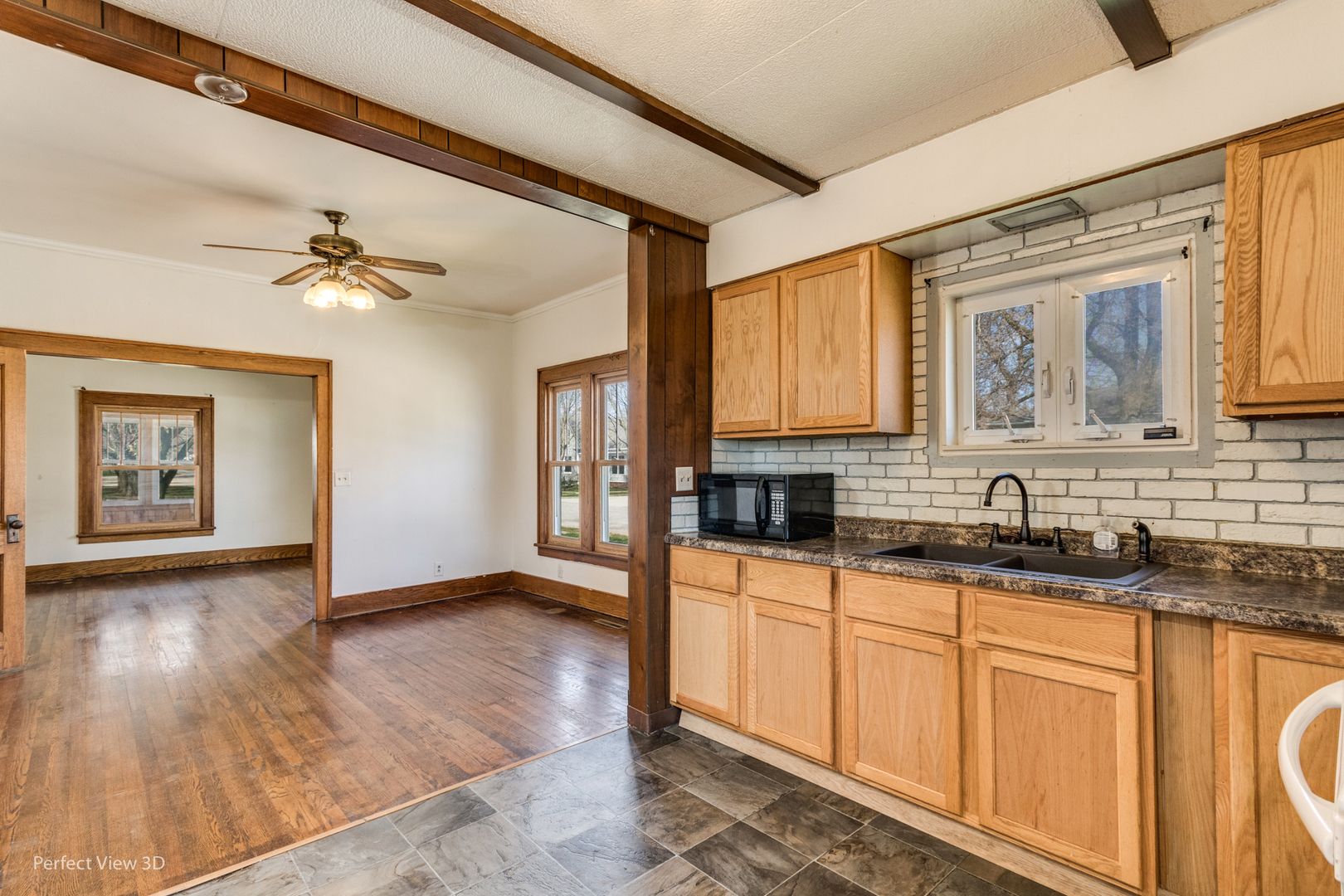 301 South Lincoln Street Ransom, IL 60470 - Photo 11 of 27 a kitchen with granite countertop a sink cabinets and stainless steel appliances