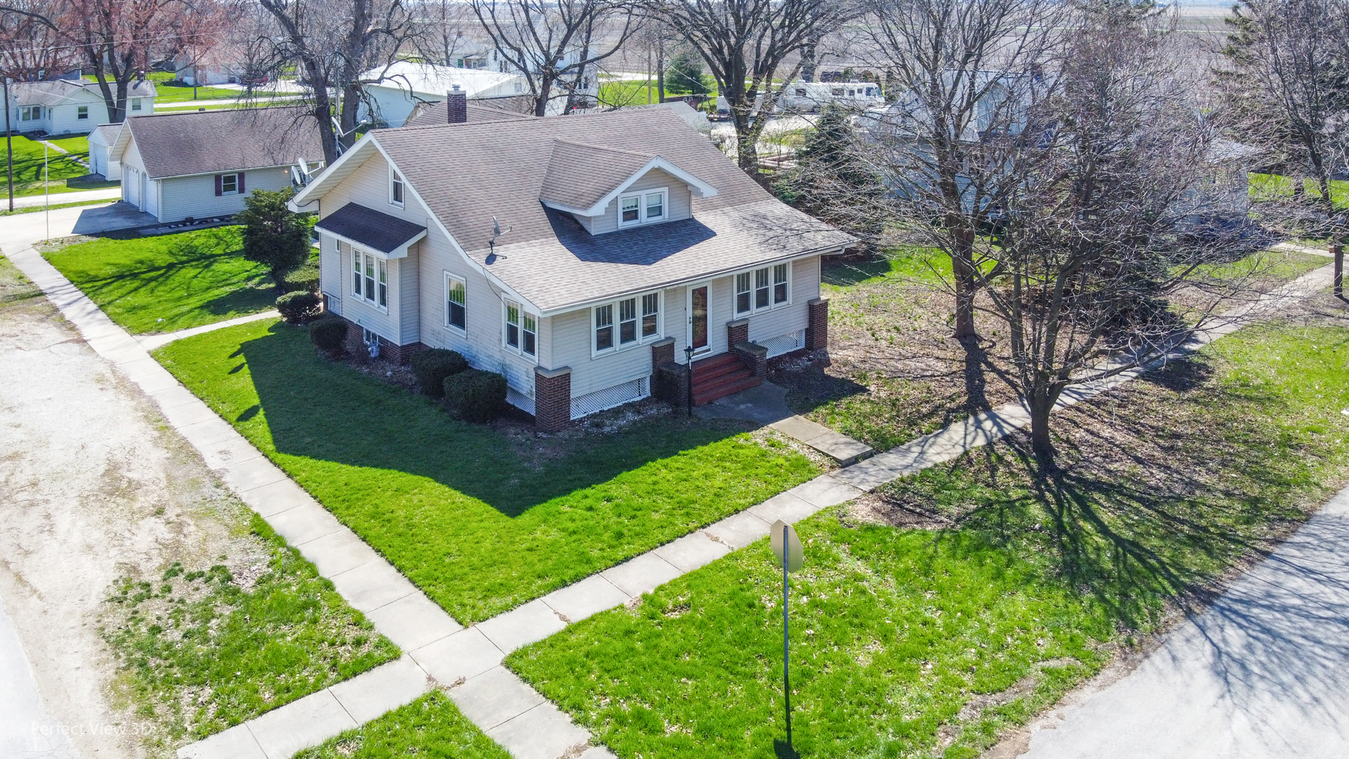 301 South Lincoln Street Ransom, IL 60470 - Photo 3 of 27 a view of a house with a big yard and large trees