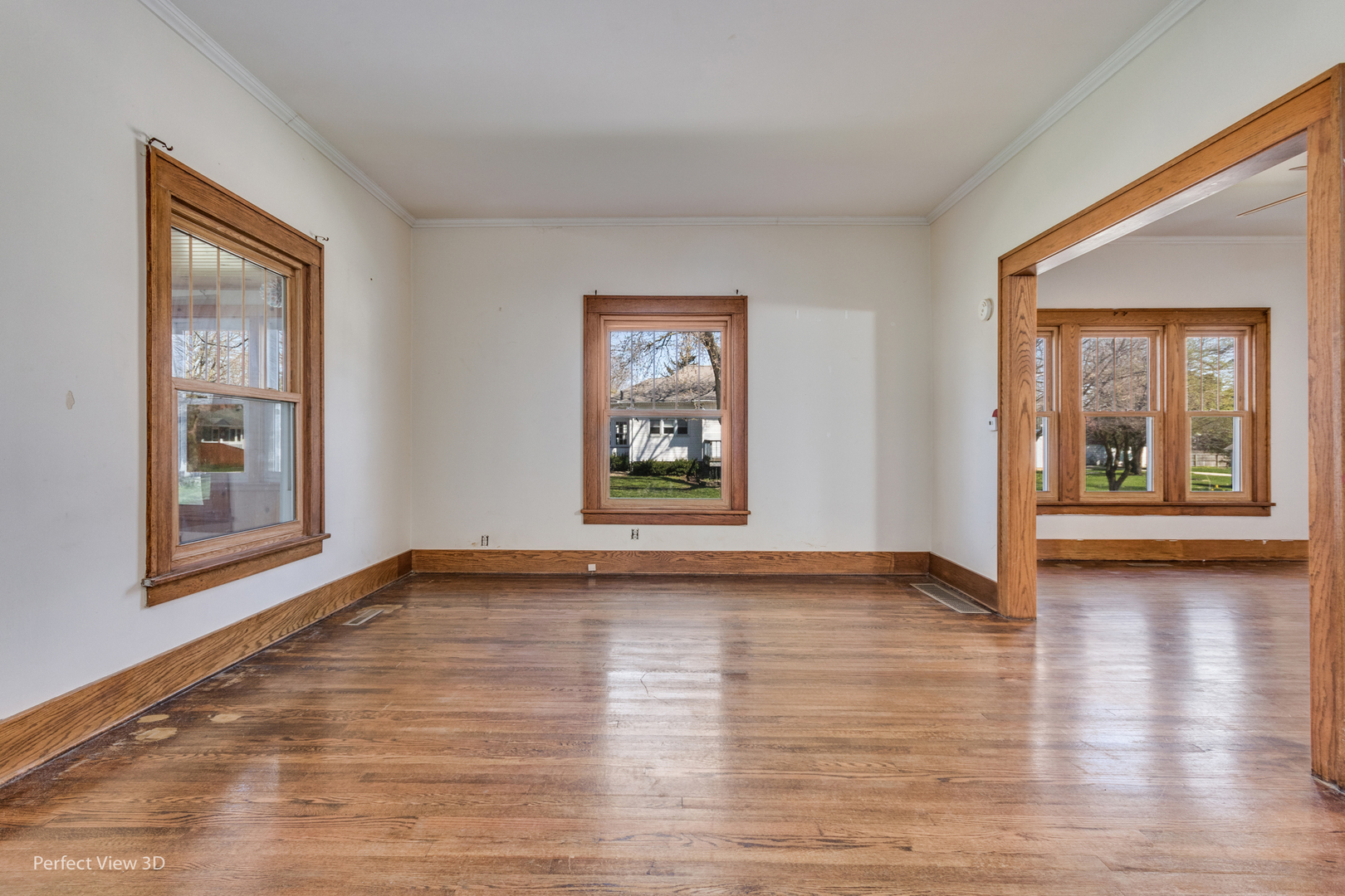 301 South Lincoln Street Ransom, IL 60470 - Photo 5 of 27 a view of an empty room with window and wooden floor