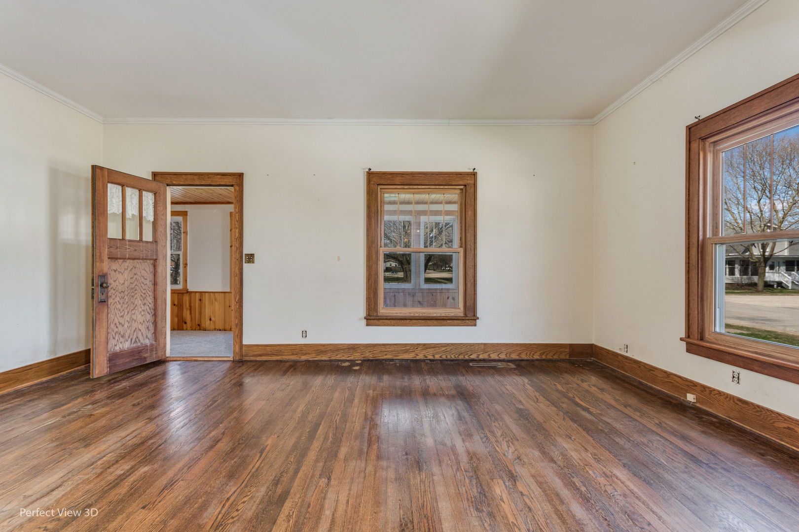 301 South Lincoln Street Ransom, IL 60470 - Photo 6 of 27 a view of an empty room with wooden floor and a window