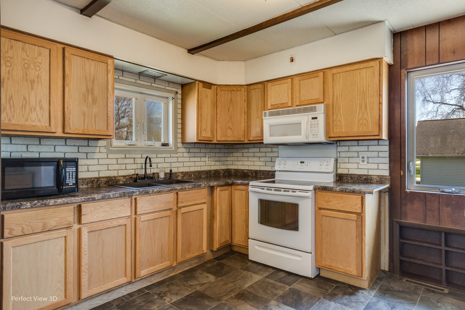 301 South Lincoln Street Ransom, IL 60470 - Photo 10 of 27 a kitchen with granite countertop white cabinets and white appliances