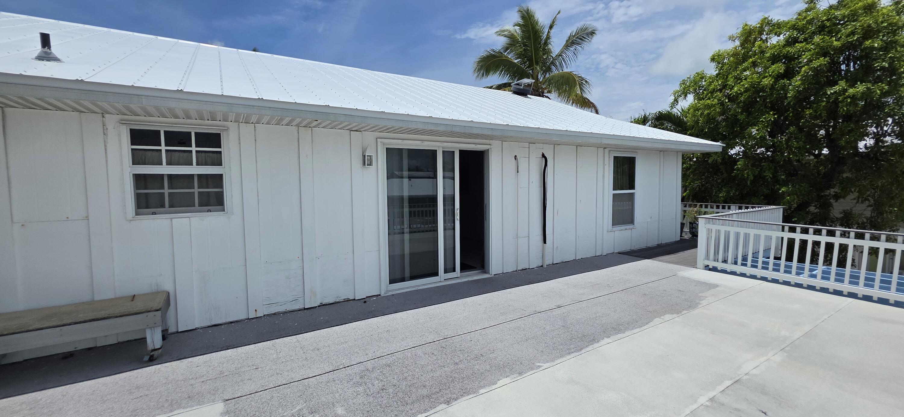 8 Emerald Drive Key West, FL 33040 - Photo 40 of 43 a view of a house with a porch